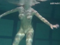FreeKiloSex presents: Naked brunette with big tits swims solo