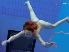 FreeKiloSex presents: Curly hair redhead swims and looks sexy