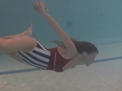 FreeKiloSex presents: Leggy girl swims and strips naked in pool