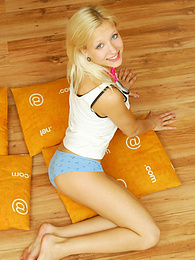 FreeKiloSex presents: Amazing blonde nude teen decided to place herself at the attic of her wooden house on four orange pillows for her dirty intention.